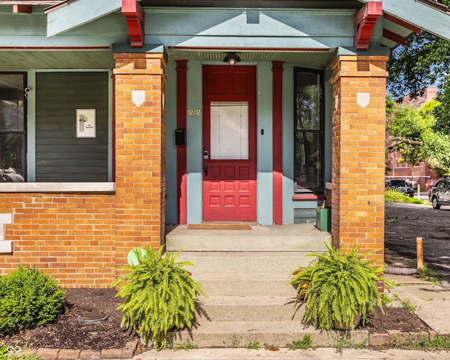 doorway to property featuring a porch