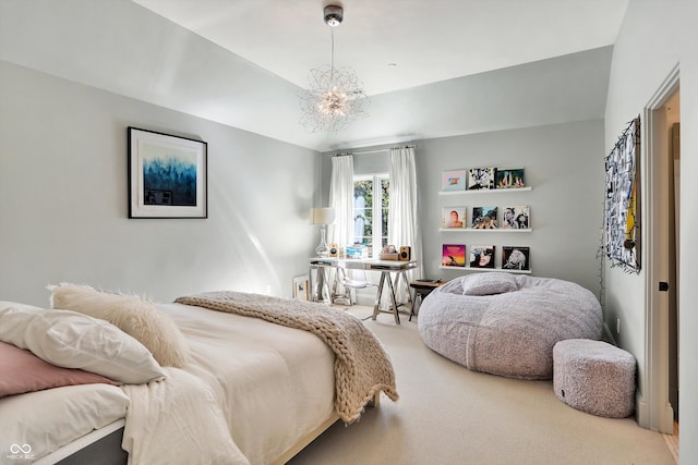 carpeted bedroom featuring a notable chandelier and lofted ceiling