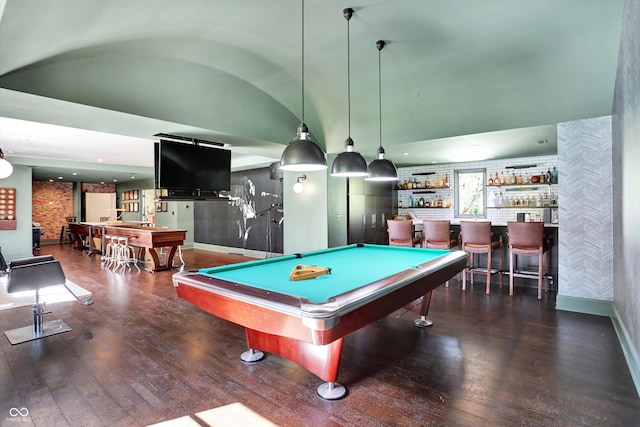 game room with dark wood-type flooring, billiards, vaulted ceiling, and indoor bar