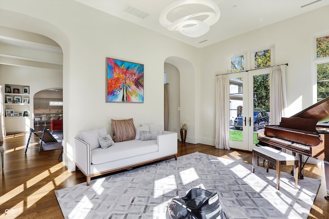 living area featuring hardwood / wood-style floors and french doors