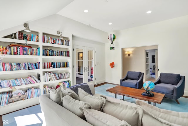 living room with french doors and hardwood / wood-style floors