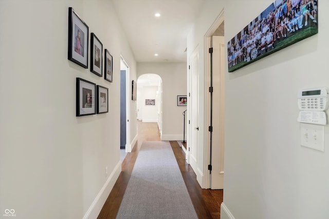 hall with dark wood-type flooring