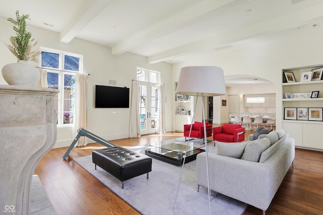 living room featuring hardwood / wood-style flooring and beam ceiling