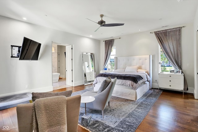 bedroom featuring wood-type flooring, ensuite bathroom, and ceiling fan