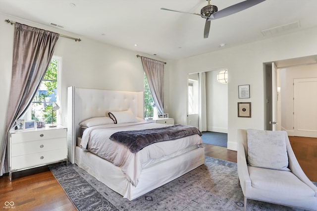 bedroom featuring ceiling fan and dark wood-type flooring