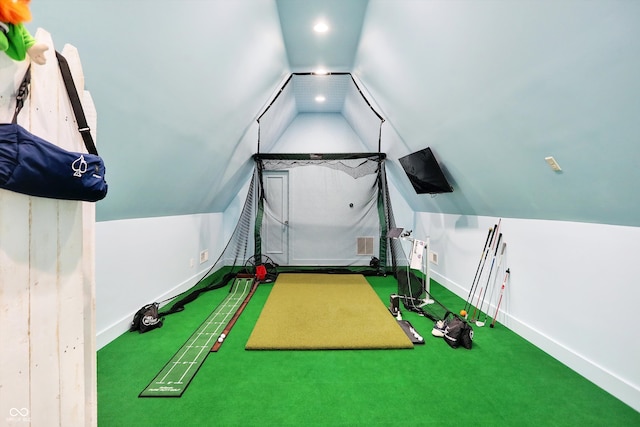 exercise area featuring carpet floors and vaulted ceiling