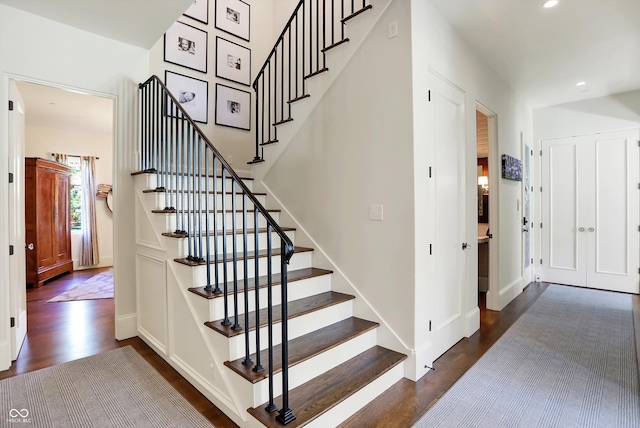 stairway featuring hardwood / wood-style floors