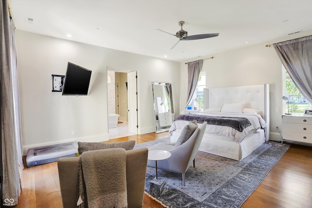 bedroom with ceiling fan and wood-type flooring