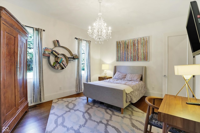 bedroom featuring a chandelier and dark wood-type flooring