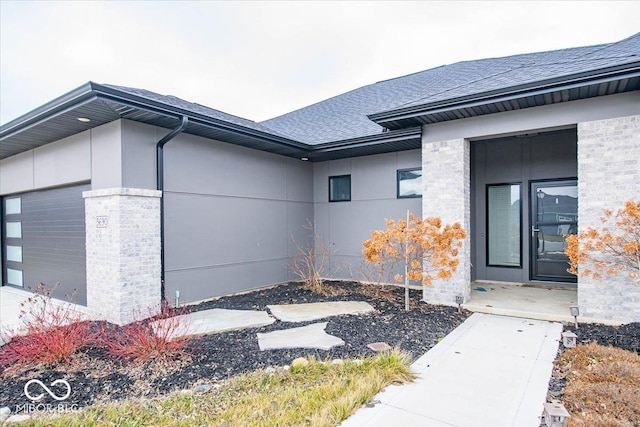 view of exterior entry with a garage