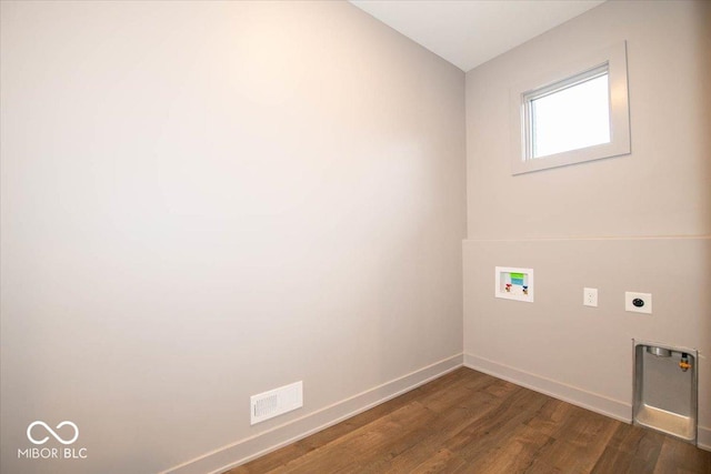 laundry area featuring hookup for an electric dryer, washer hookup, and dark hardwood / wood-style flooring