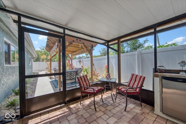 sunroom / solarium with a wealth of natural light