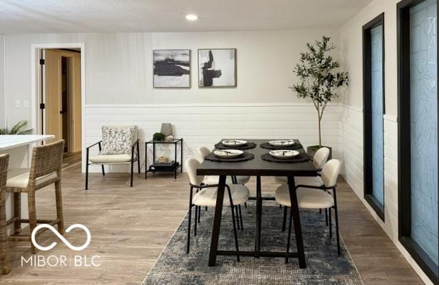 dining room with recessed lighting and wood finished floors