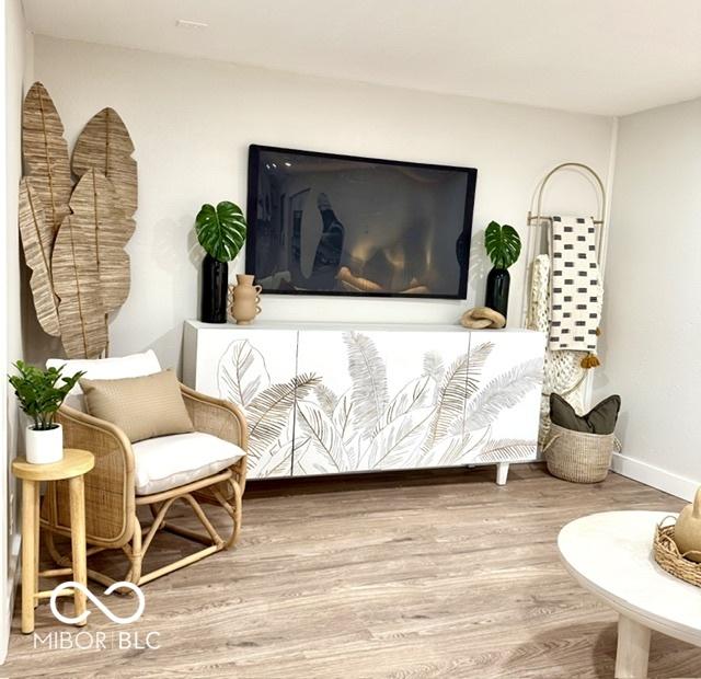 sitting room featuring baseboards and wood finished floors