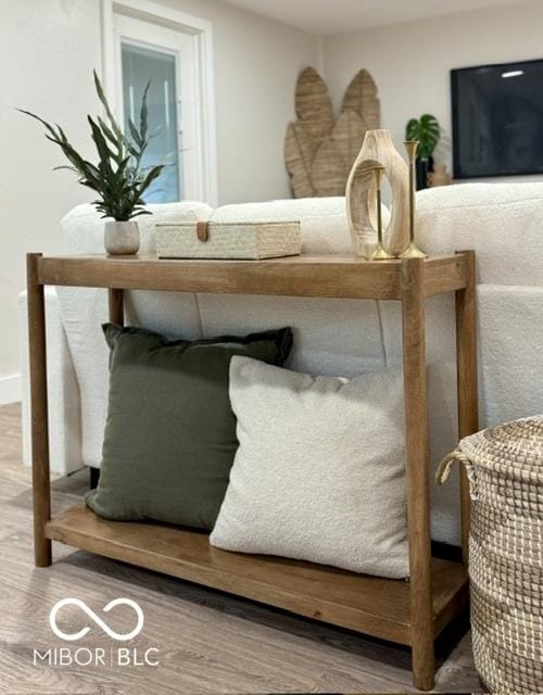 interior details featuring baseboards and wood finished floors