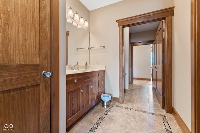 bathroom with tile patterned floors and vanity