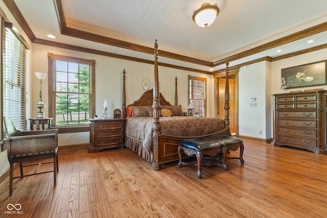 bedroom featuring crown molding and light hardwood / wood-style floors