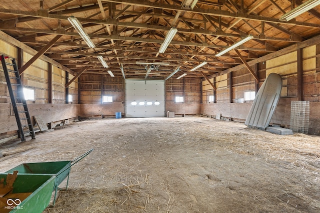 misc room featuring plenty of natural light and high vaulted ceiling