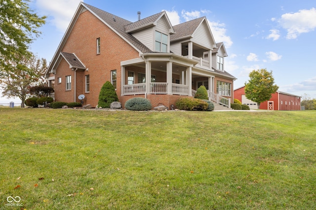 view of front of home with covered porch and a front yard