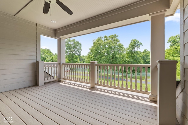 wooden terrace featuring ceiling fan