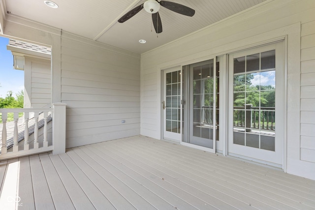 wooden terrace featuring ceiling fan