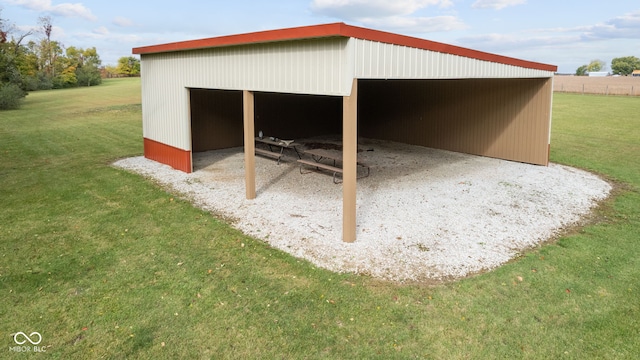 view of outdoor structure featuring a lawn