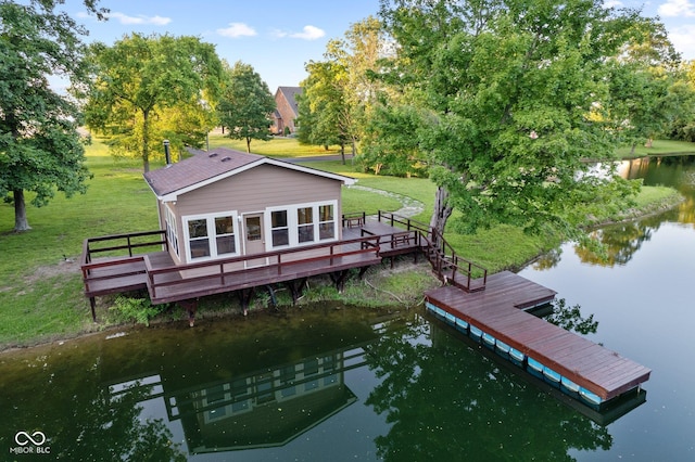 view of dock with a lawn and a deck with water view