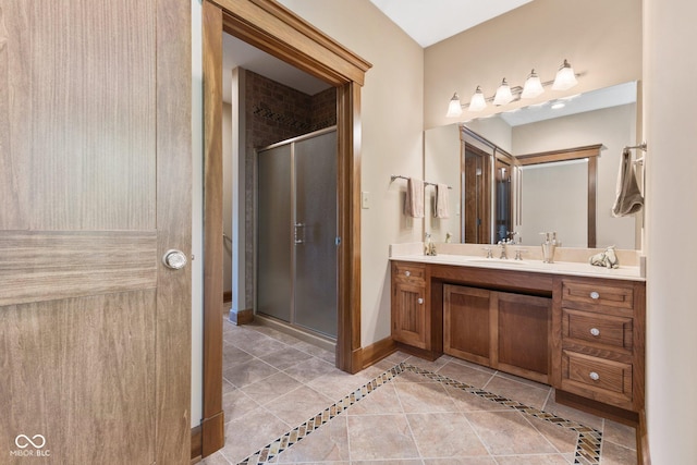 bathroom with vanity, tile patterned flooring, and walk in shower