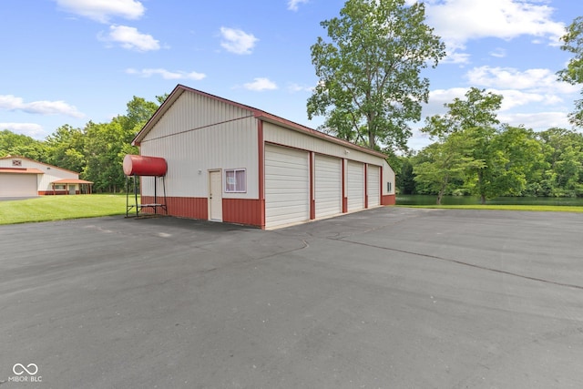 garage featuring a yard