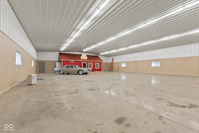 garage featuring wood walls