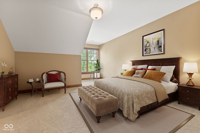 bedroom featuring lofted ceiling and light carpet