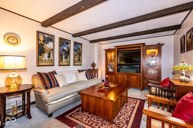 living room featuring beam ceiling and carpet