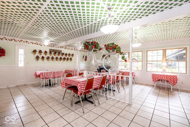 dining space featuring light tile patterned floors