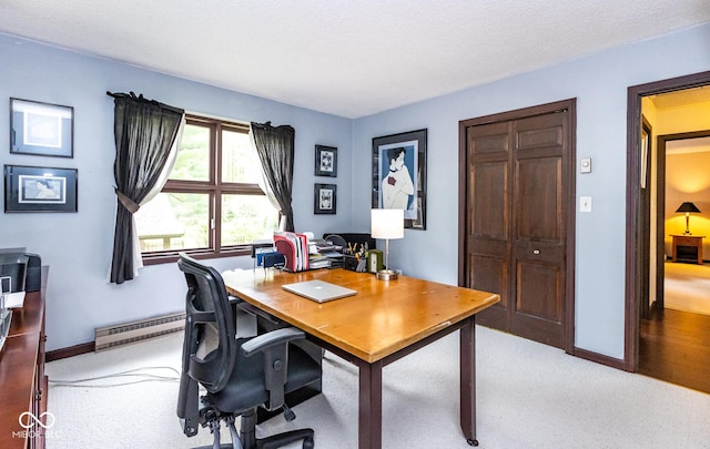 carpeted home office with a baseboard radiator and a textured ceiling