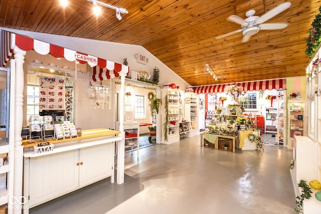 kitchen featuring vaulted ceiling, wooden ceiling, and ceiling fan