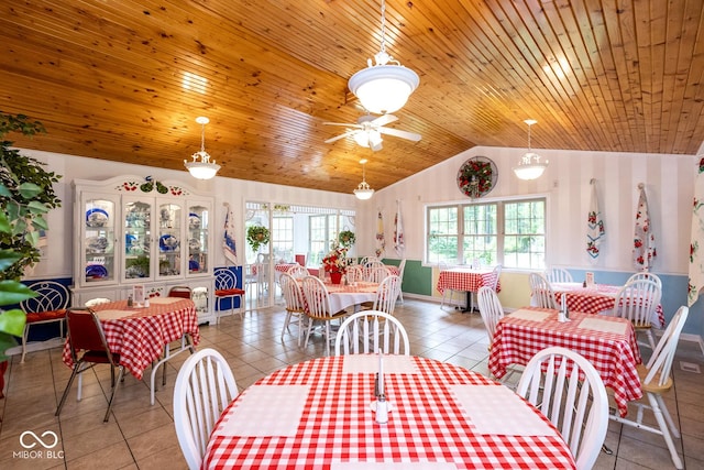 tiled dining space featuring wood ceiling, vaulted ceiling, and ceiling fan