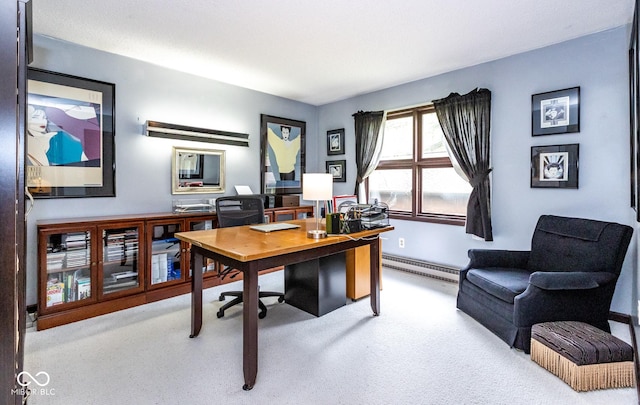 office space with a baseboard radiator and light colored carpet