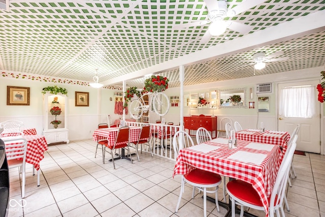 tiled dining area featuring ceiling fan