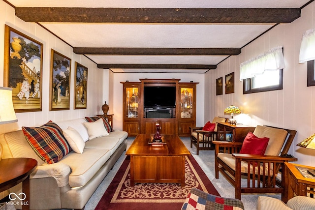 living room featuring beam ceiling