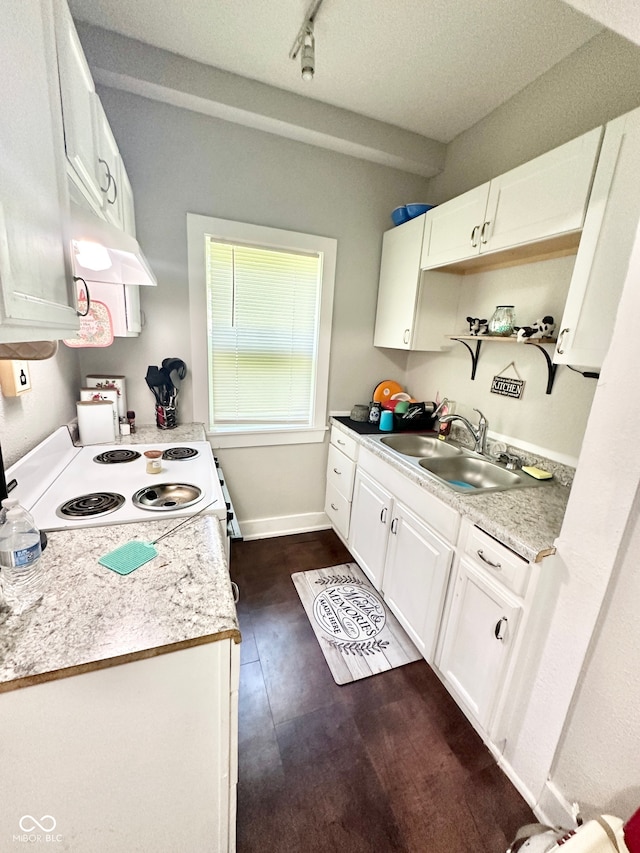 kitchen featuring dark hardwood / wood-style flooring, white cabinetry, sink, and a textured ceiling