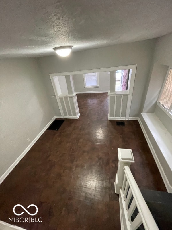 interior space with a textured ceiling