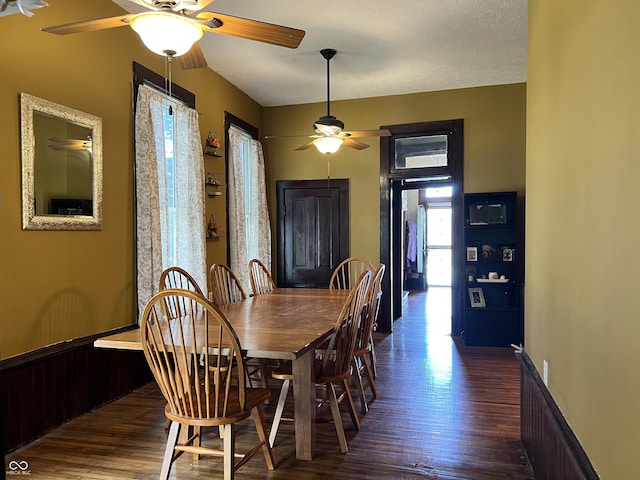 dining room featuring ceiling fan and dark hardwood / wood-style flooring