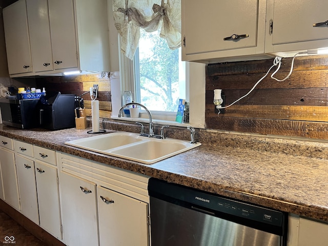 kitchen with dishwasher, white cabinetry, plenty of natural light, and sink