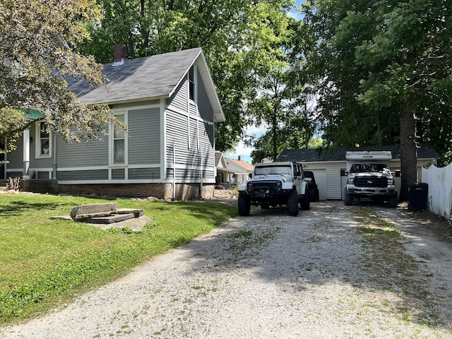 view of side of home featuring a yard