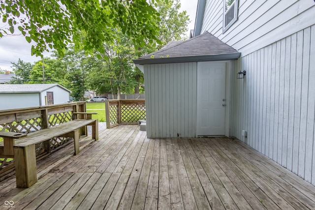 wooden deck with an outdoor structure