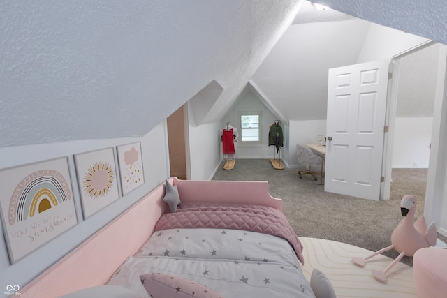 carpeted bedroom featuring lofted ceiling and a textured ceiling