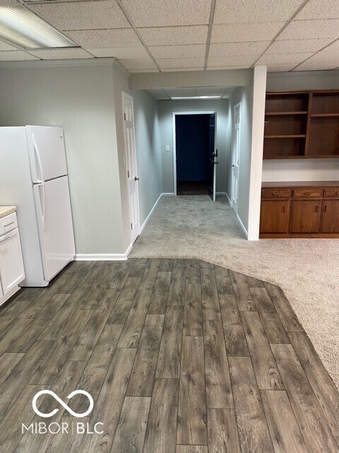 2976 N Scatterfield Rd, Anderson, IN 46012 - hall featuring wood finished floors and a drop ceiling