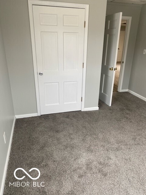 2976 N Scatterfield Rd, Anderson, IN 46012 - unfurnished bedroom featuring carpet flooring and a closet