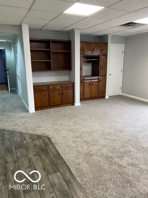 2976 N Scatterfield Rd, Anderson, IN 46012 - unfurnished living room with dark wood finished floors and dark colored carpet