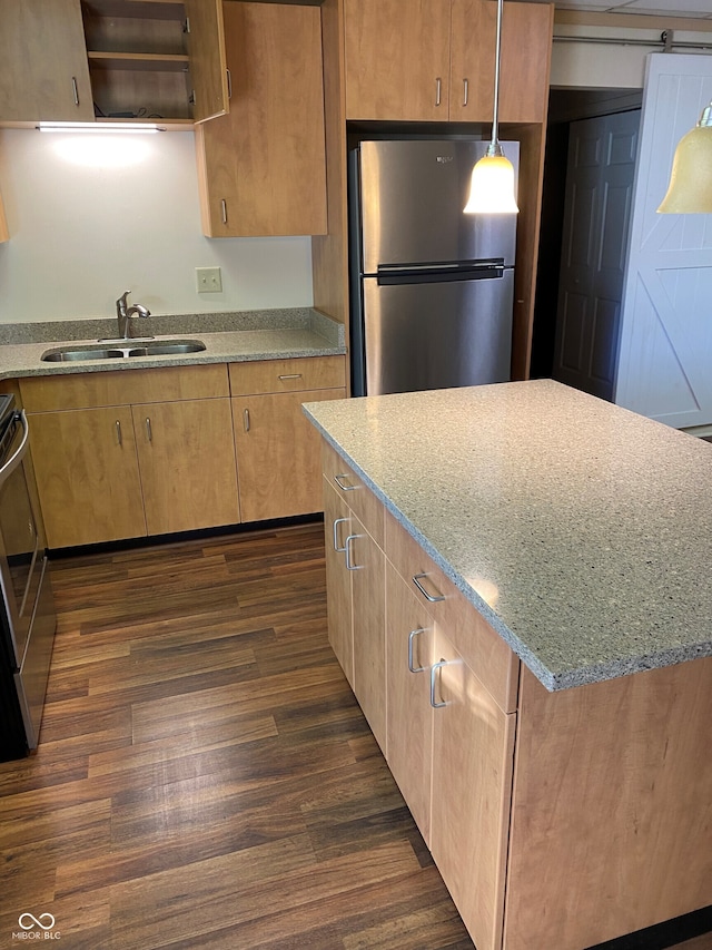 2976 N Scatterfield Rd, Anderson, IN 46012 - kitchen with freestanding refrigerator, light stone countertops, a kitchen island, dark wood-style floors, and stove